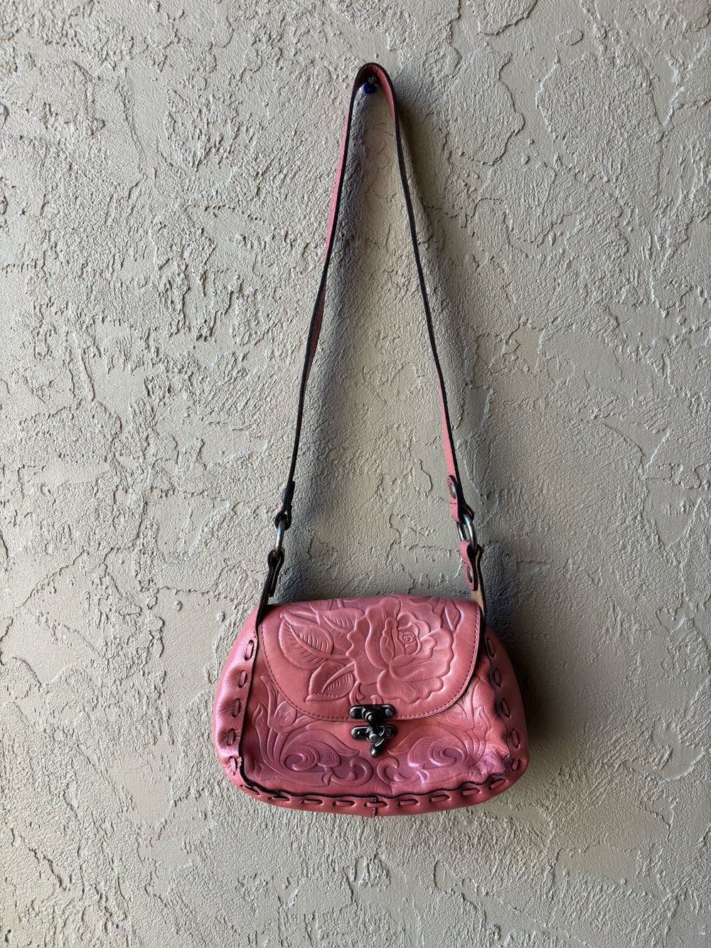pink rose-tooled leather shoulder bag Patricia Nash Micaela baguette bag.